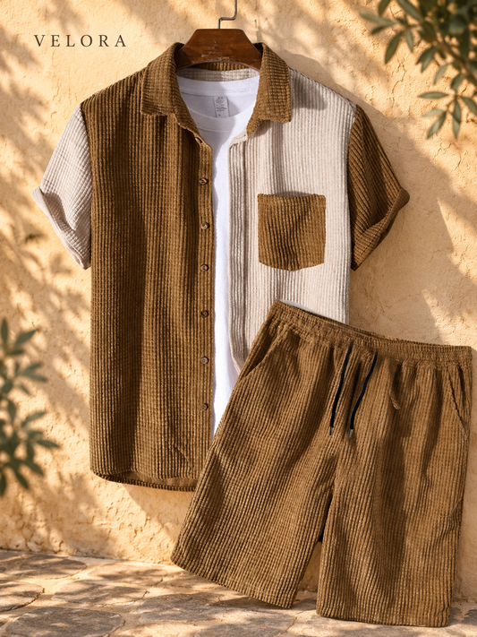Men's color block shirt and shorts set against sunlit plaster backdrop