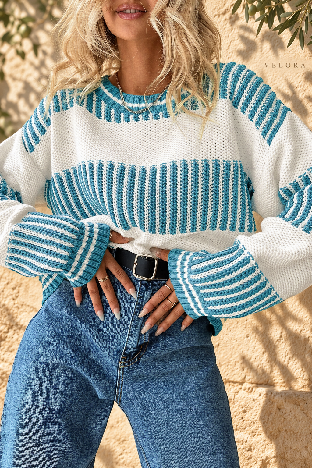 Two-Tone Striped Drop Shoulder Sweater turquoise and cream front view, VELORA Mediterranean setting