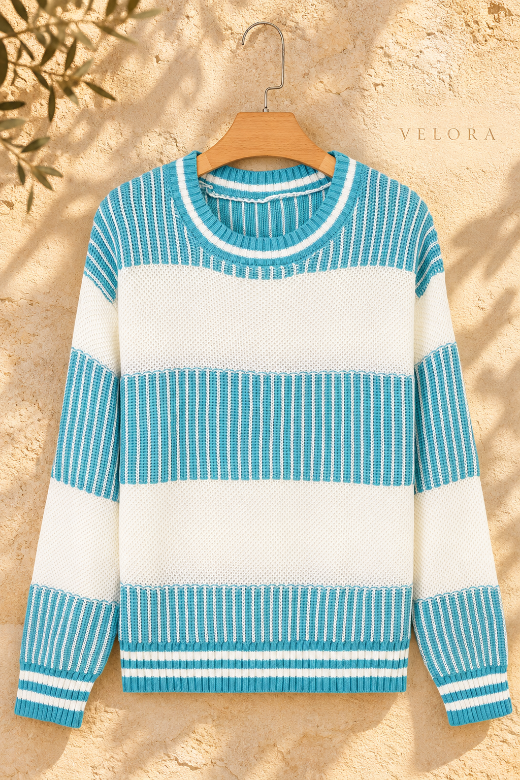 Two-Tone Striped Drop Shoulder Sweater turquoise and cream hanger front view, VELORA Mediterranean setting