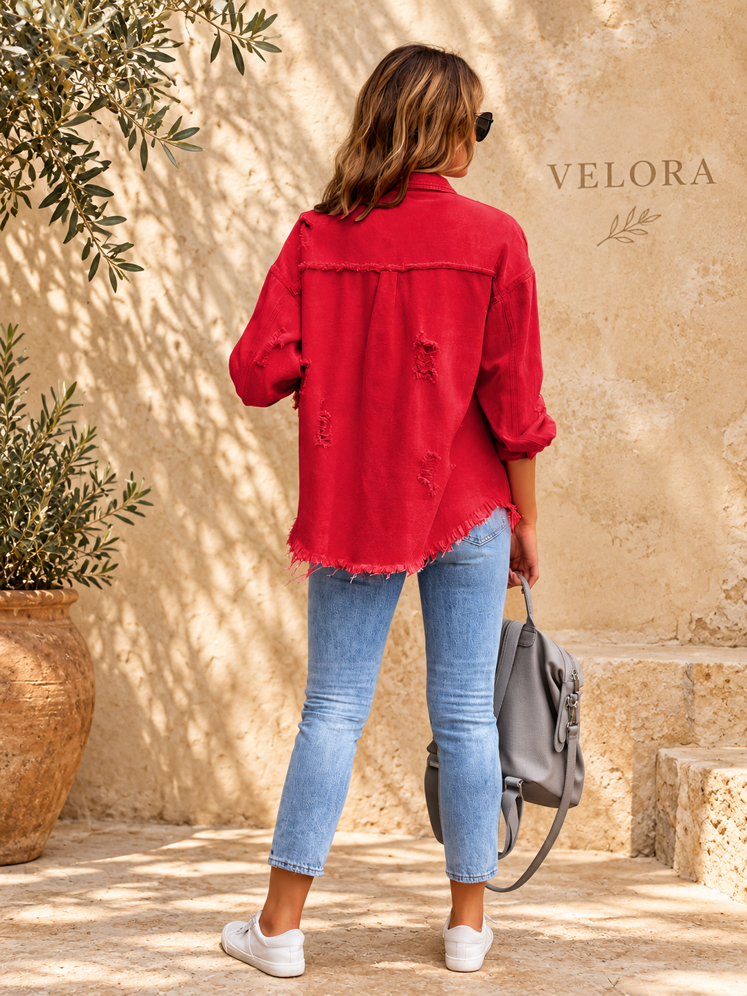VELORA denim jacket variation 15 on warm Mediterranean plaster