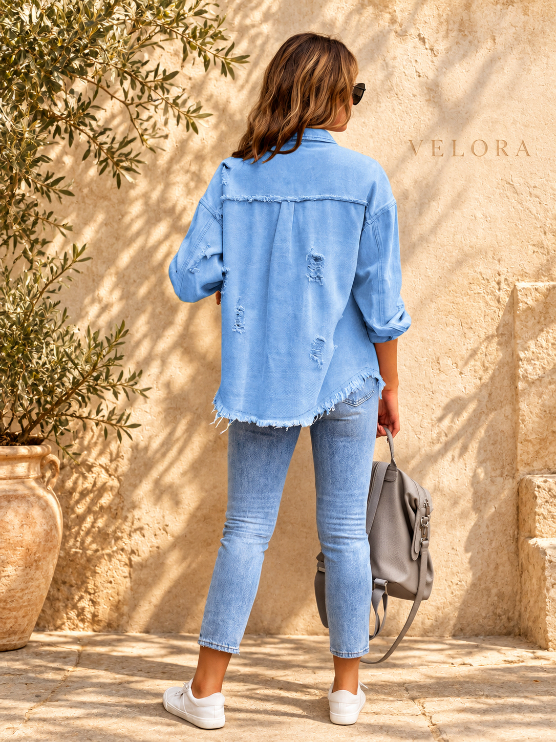VELORA denim jacket variation 35 on warm Mediterranean plaster