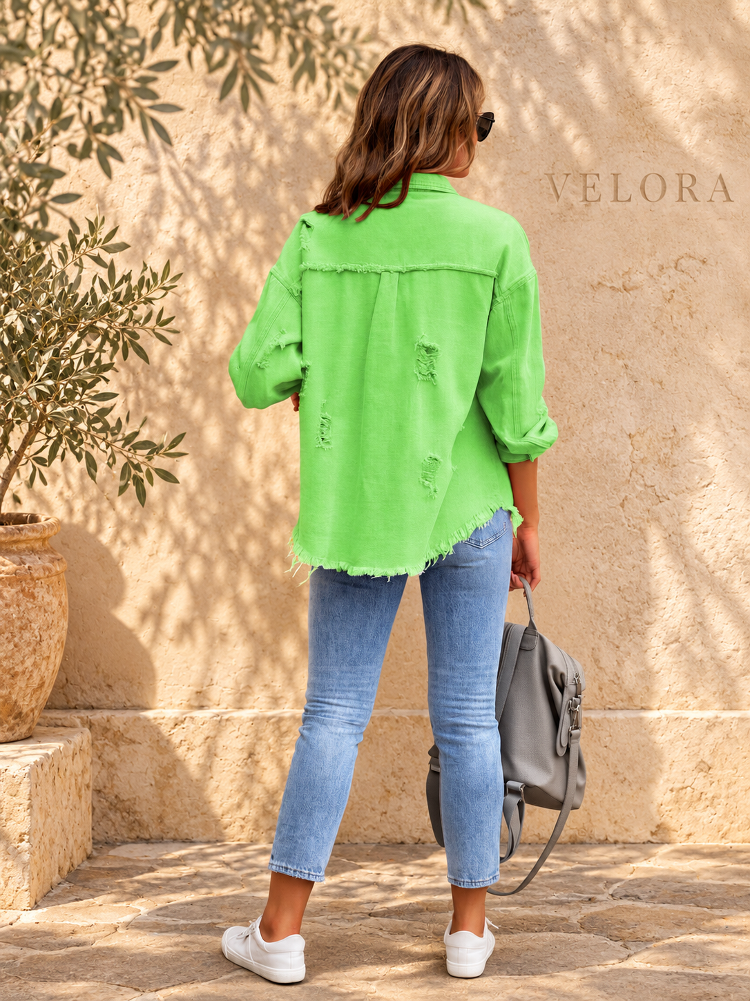 VELORA denim jacket variation 6 on warm Mediterranean plaster