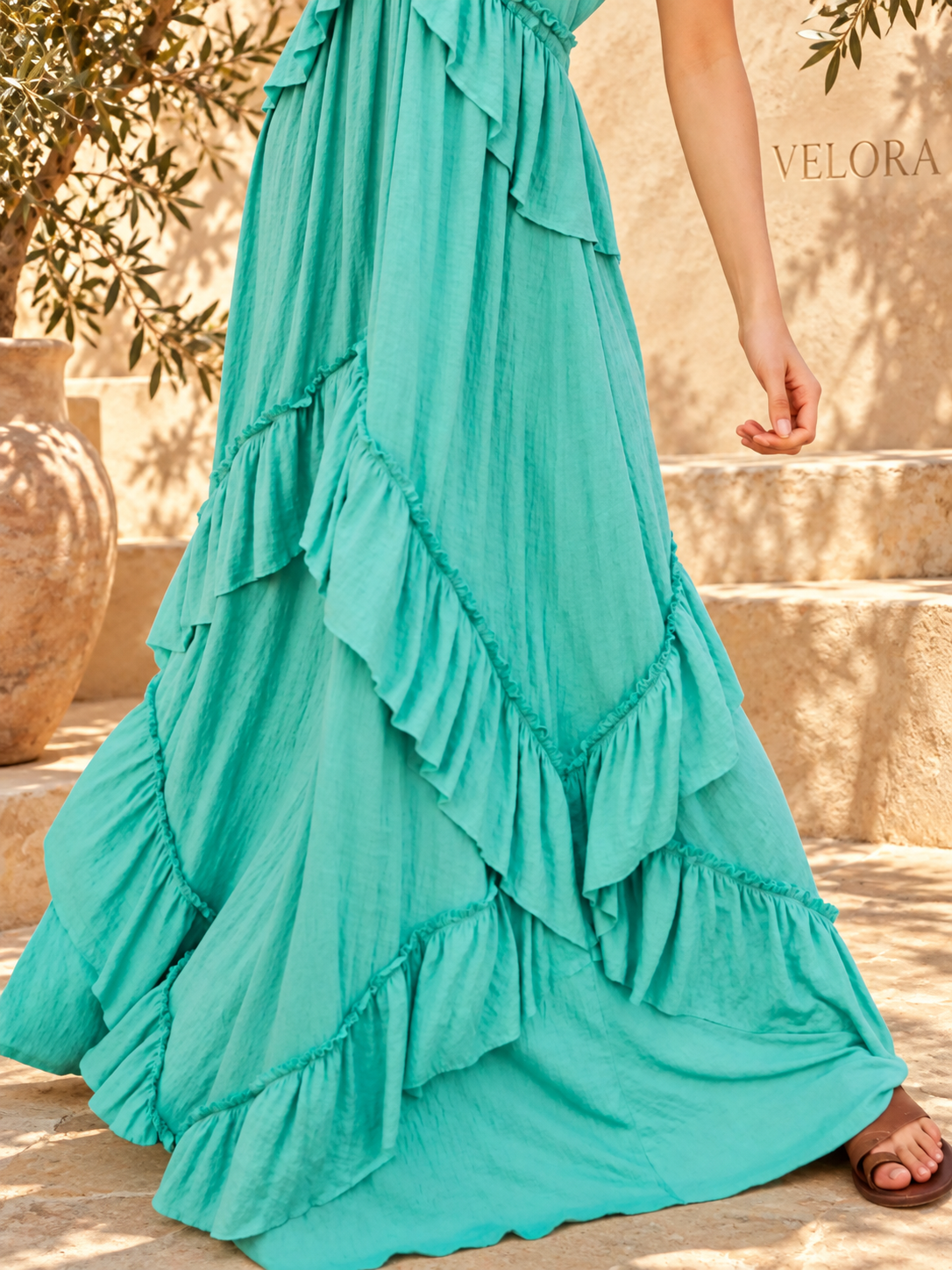 VELORA ruffled maxi dress look 30 on Mediterranean plaster