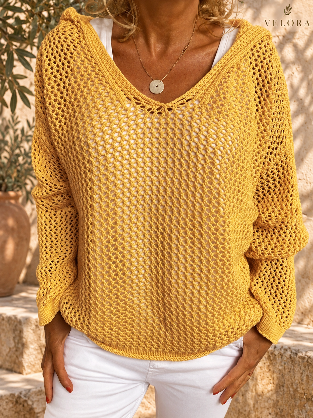 VELORA openwork knit cover-up detail 1 Mediterranean background