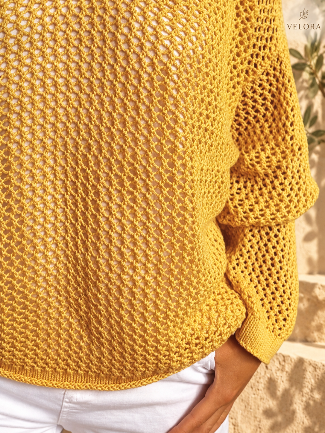 VELORA openwork knit cover-up detail 3 Mediterranean background