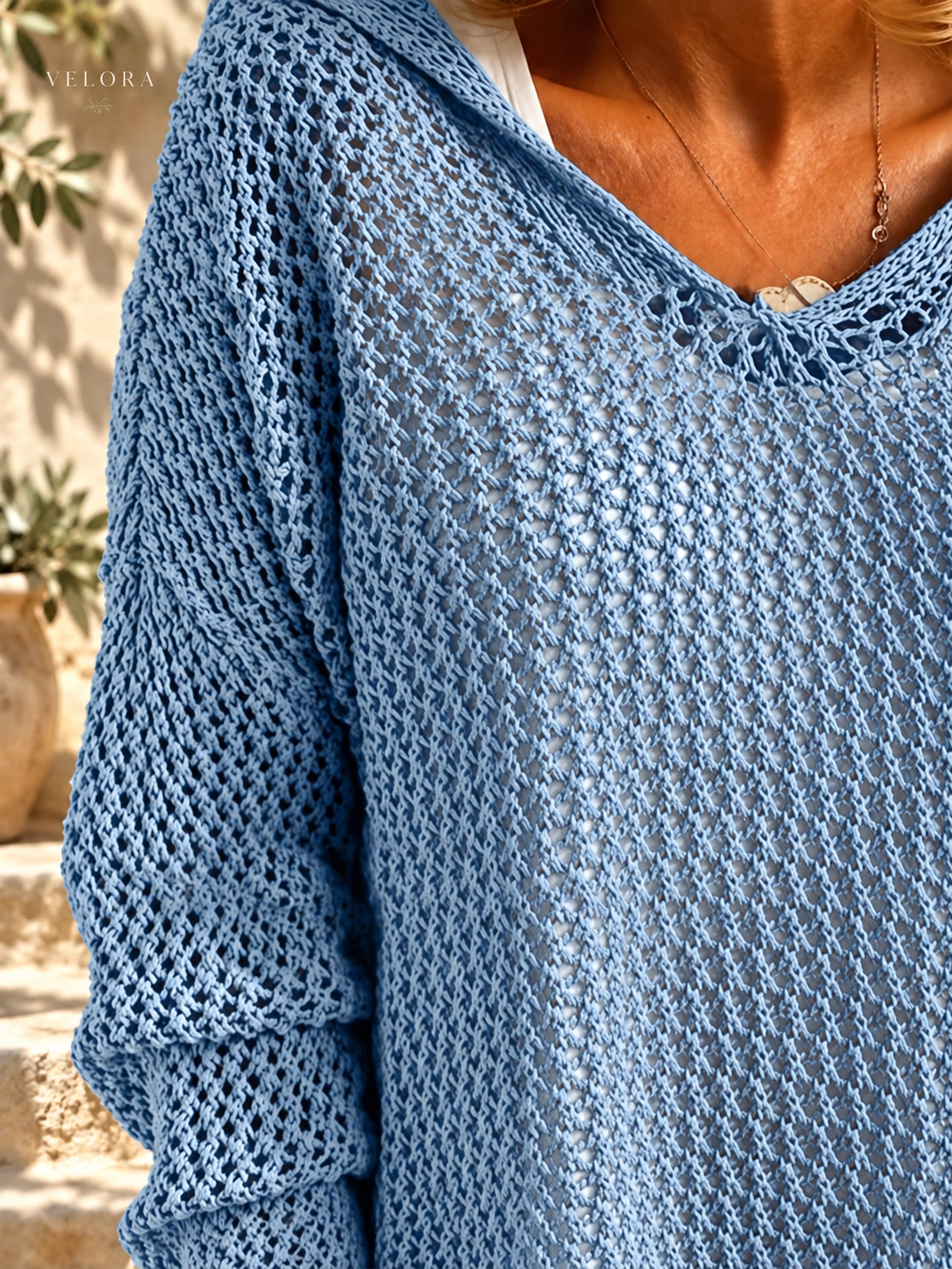 VELORA openwork knit cover-up detail 5 Mediterranean background