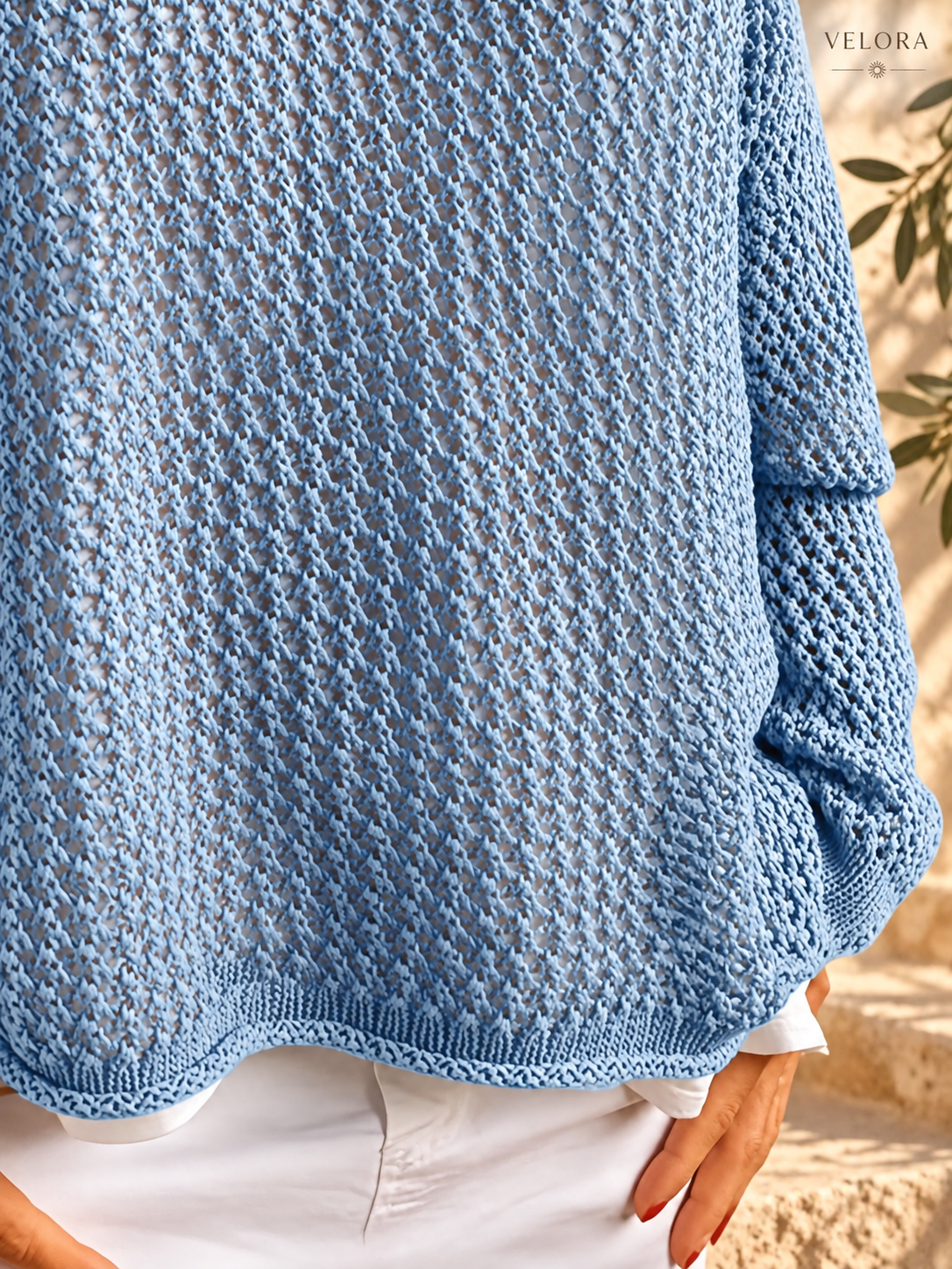 VELORA openwork knit cover-up detail 6 Mediterranean background