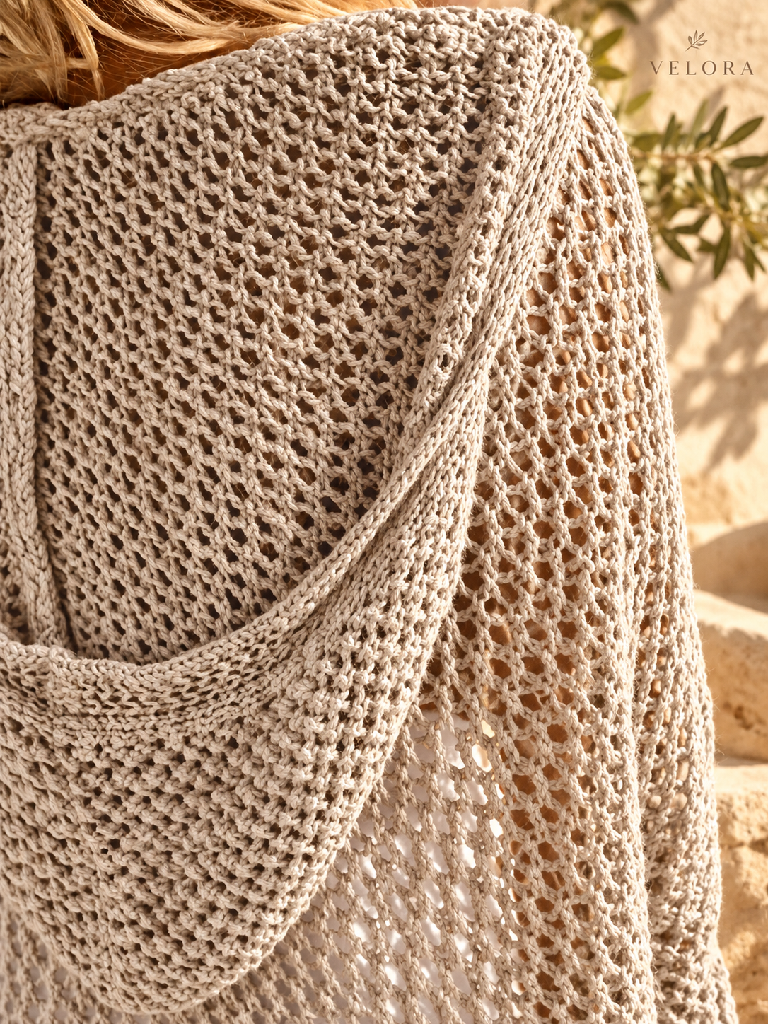 VELORA openwork knit cover-up detail 8 Mediterranean background