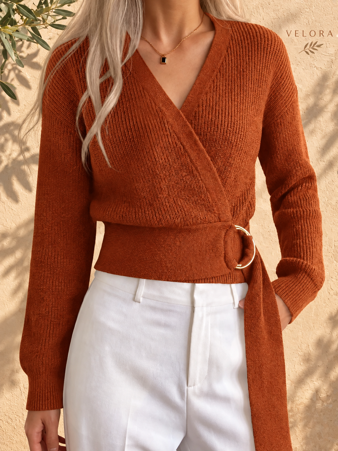 VELORA metal-ring sweater look 1 on Mediterranean plaster