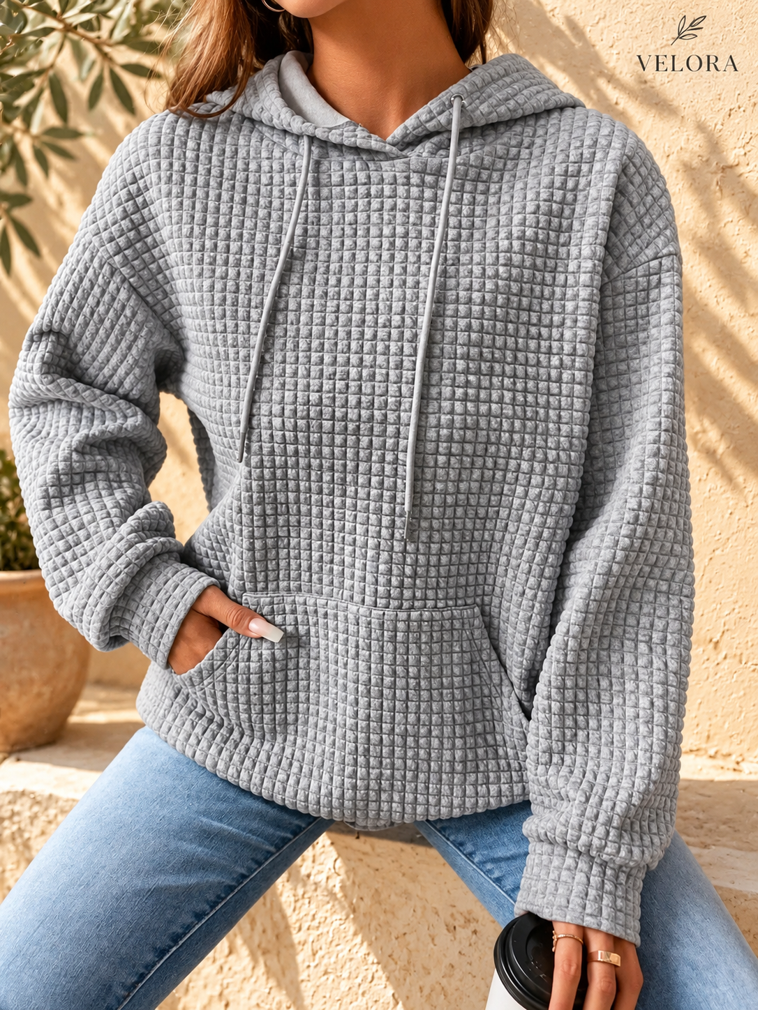 VELORA textured hoodie look 2 on warm Mediterranean plaster