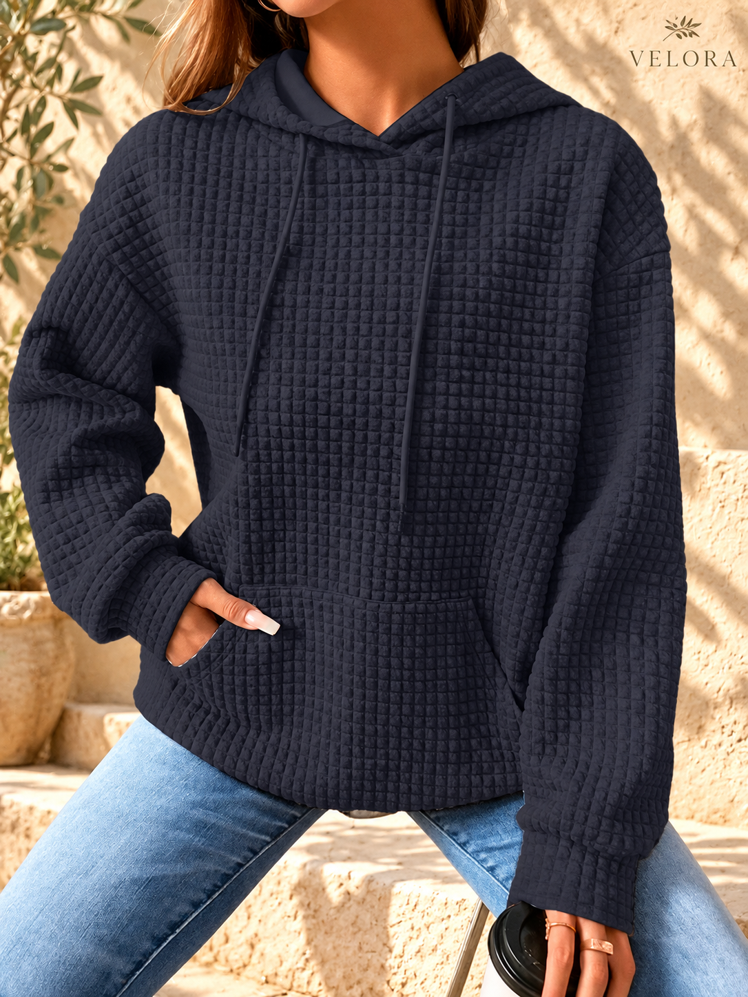 VELORA textured hoodie look 13 on warm Mediterranean plaster