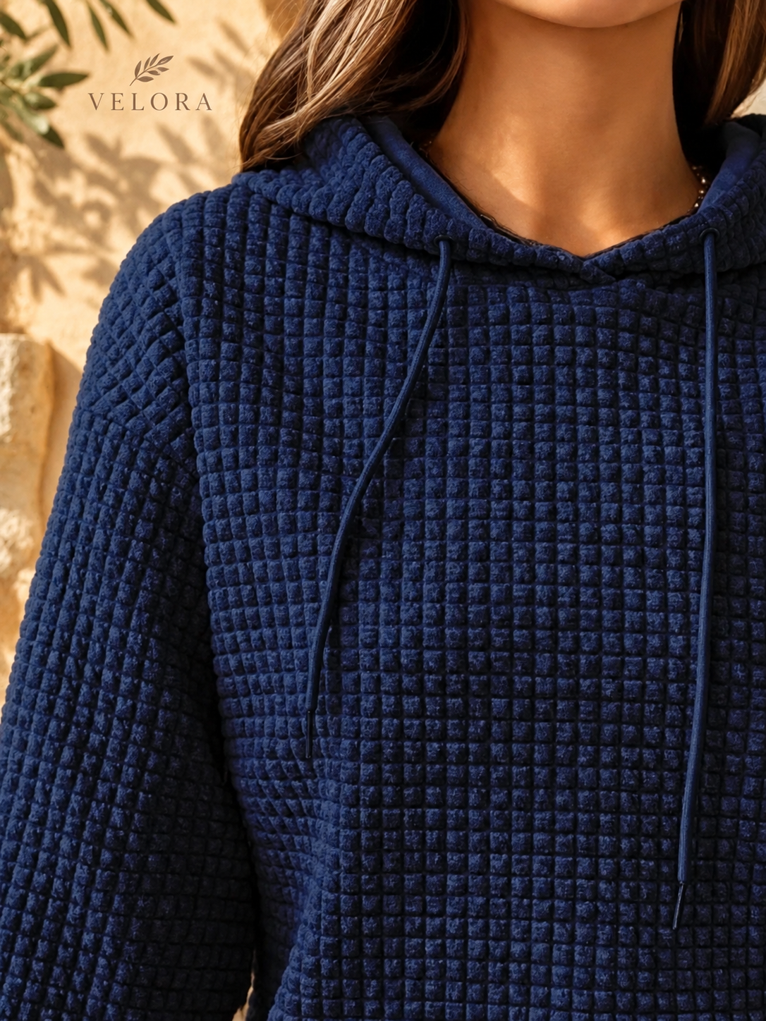 VELORA textured hoodie look 14 on warm Mediterranean plaster