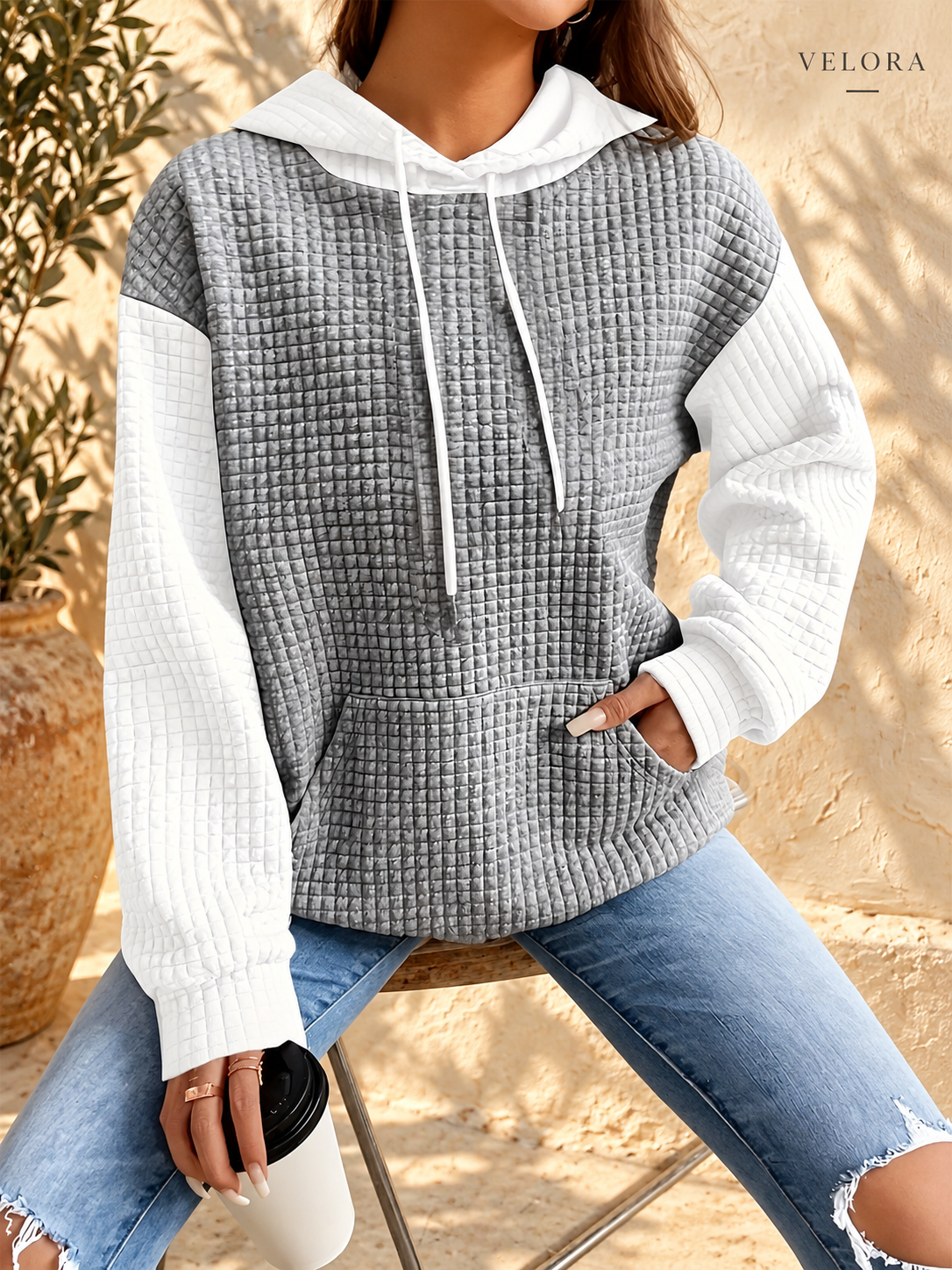VELORA textured hoodie look 19 on warm Mediterranean plaster