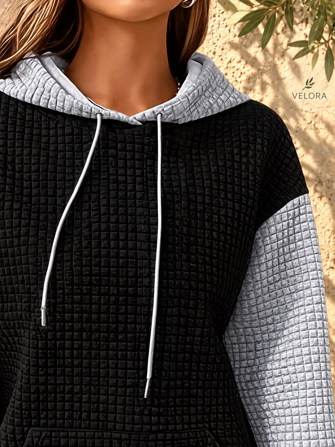 VELORA textured hoodie look 22 on warm Mediterranean plaster
