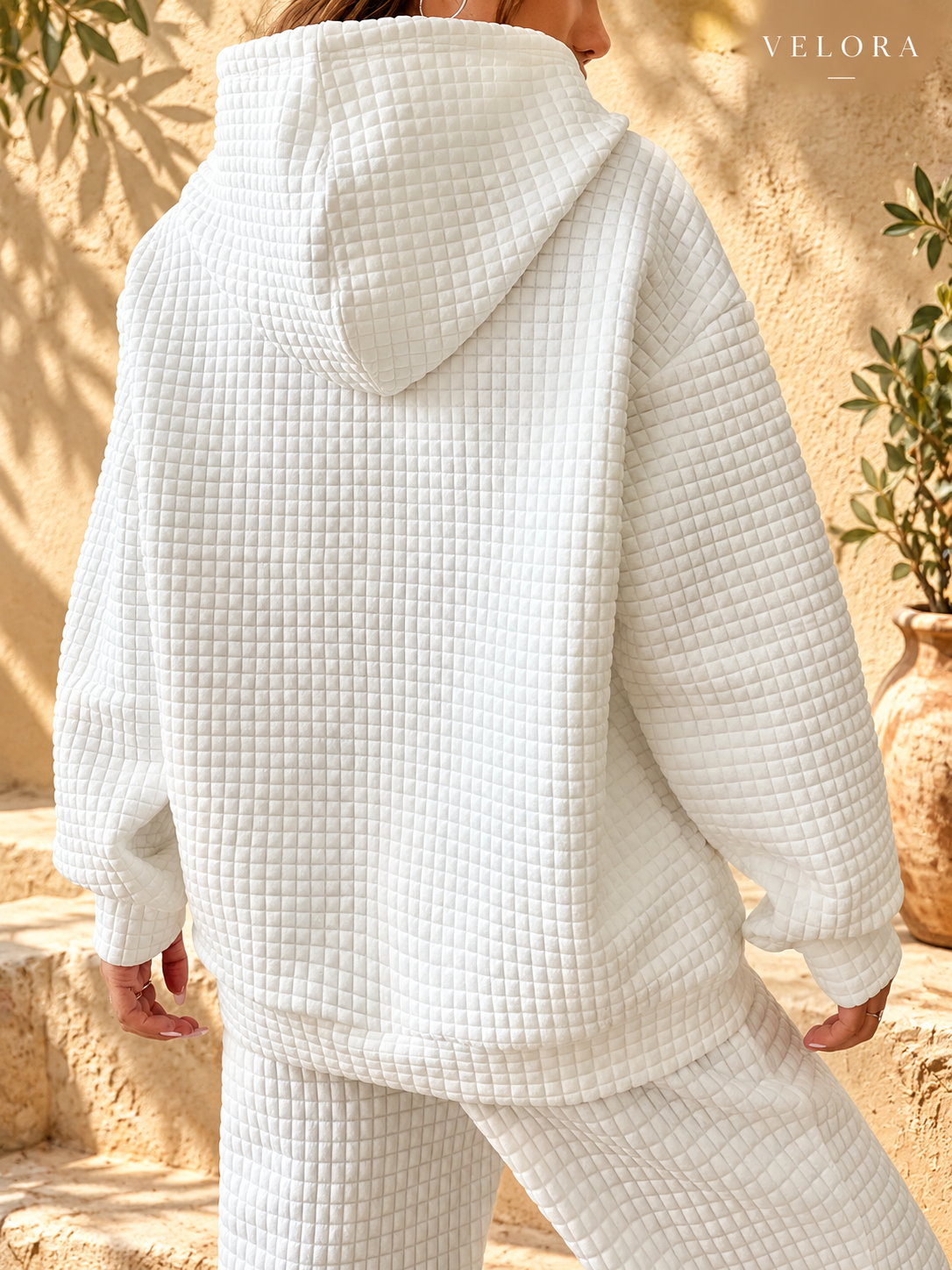 VELORA textured hoodie look 8 on warm Mediterranean plaster